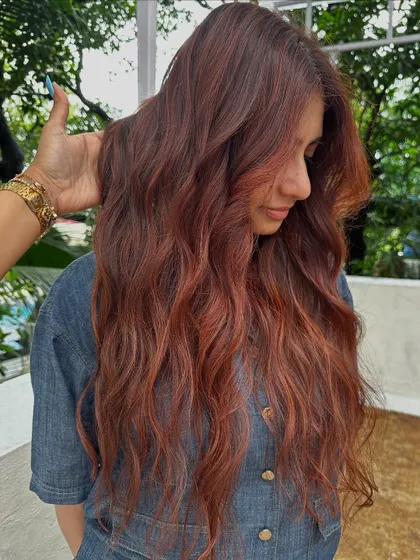 Holiday hair with a beautiful red tint.