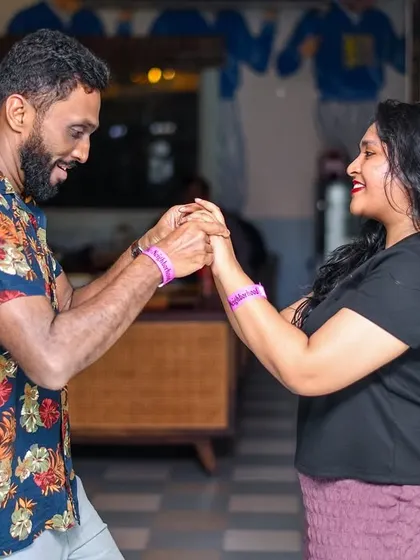A beautiful, connected moment between two dancers. It’s all about feeling the music together on the dance floor.