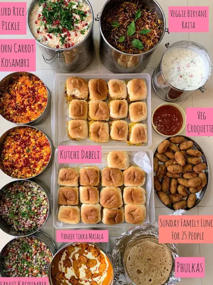 A Sunday family lunch for 25 people, filled with delicious choices. The spread included Kutchi Dabeli, Veg Croquettes, Paneer Tikka Masala, and Veg Biryani.