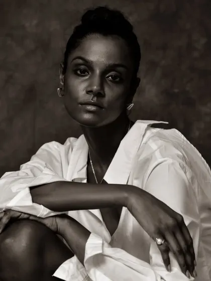 A confident and engaging black and white portrait.