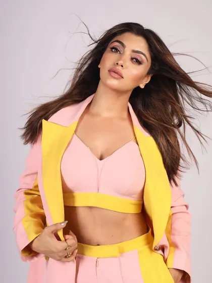 A close-up of a model in a pink and yellow suit, showing my skill in capturing sharp details and natural skin texture.