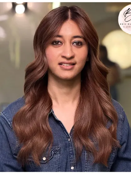 A full look at this earthy and elegant rich brown color. The gloss and dimension make her hair look incredibly healthy and vibrant.