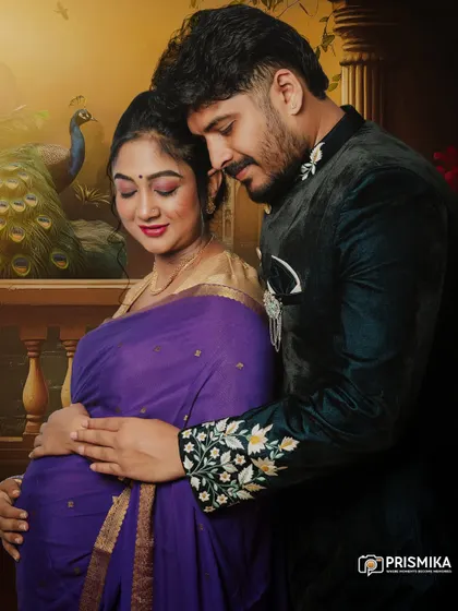 We celebrate love in all its forms, including the beauty of tradition. This couple's maternity portrait showcases a classic Indian style, with the mother-to-be in a beautiful purple saree and her partner in an embroidered jacket, creating a timeless and elegant memory.