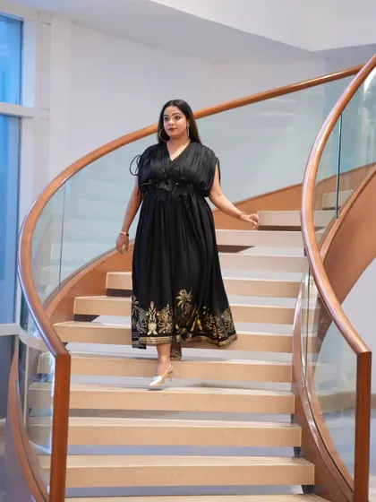 Walking down the grand staircase at the venue for the Fracto Prop launch. My entrance and presence are part of setting the tone for the entire event.