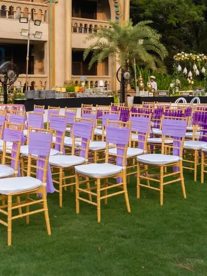 Rows of neatly arranged chairs for the ceremony, showing the attention to detail in the seating plan for a large number of guests.