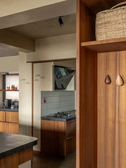 Small details, like these wooden drop-shaped hooks, add a touch of playful functionality. The kitchen is filled with these thoughtful elements that make everyday life a little more beautiful.