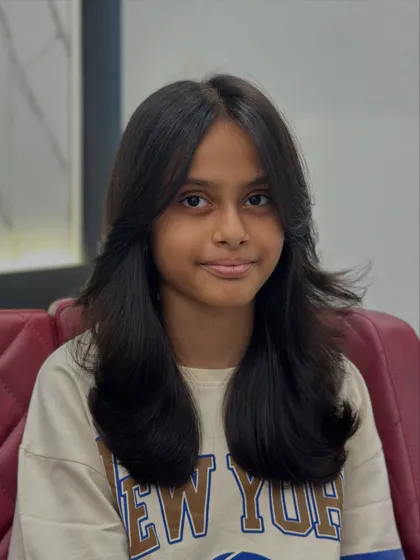 This young client is rocking her new layered haircut. It's a style that's both beautiful and easy for her to manage.
