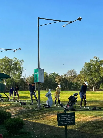 A busy practice area with our sign reminding players that this is a dedicated space for golfers and coaches.