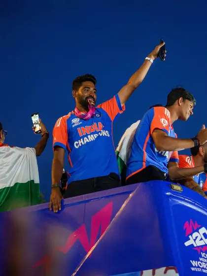 A photo series from the victory parade, capturing the Indian cricket team celebrating with the trophy on an open-top bus at Marine Drive. The images are filled with the joy and pride of the players and fans.