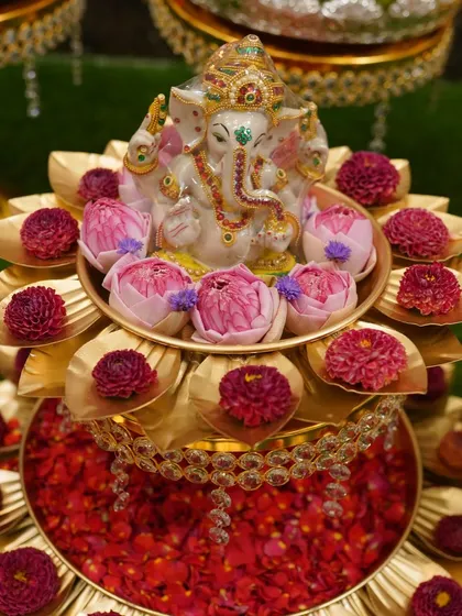 I pay a lot of attention to the details. This Ganesha idol placed on a brass lotus stand with fresh flowers is a centerpiece that brings blessings and beauty to the occasion.