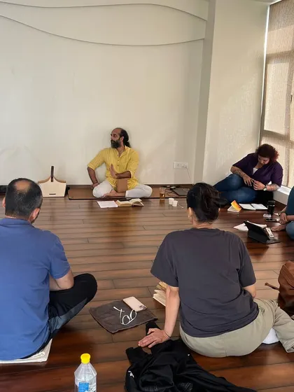 Another angle of the workshop, showing the intimate and focused setting as students absorb the teachings.
