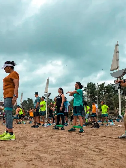 Using resistance bands on the beach to add an extra challenge to our strength training. The unstable surface of the sand engages more muscles, making every exercise more effective.