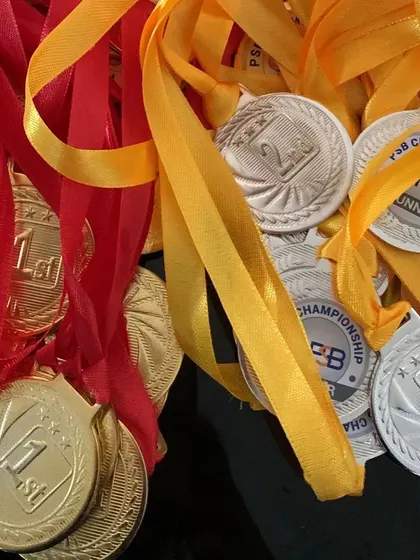A close-up of the high-quality gold and silver medals awarded to the winners and runners-up in our academy championships.