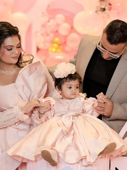 A quiet, loving moment between parents and their daughter on her first birthday. These are the candid shots that families treasure forever.