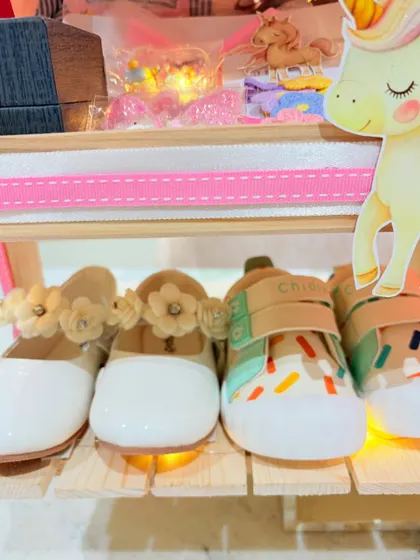 The tiniest, most adorable booties and shoes, perfectly displayed as part of the first birthday gift.