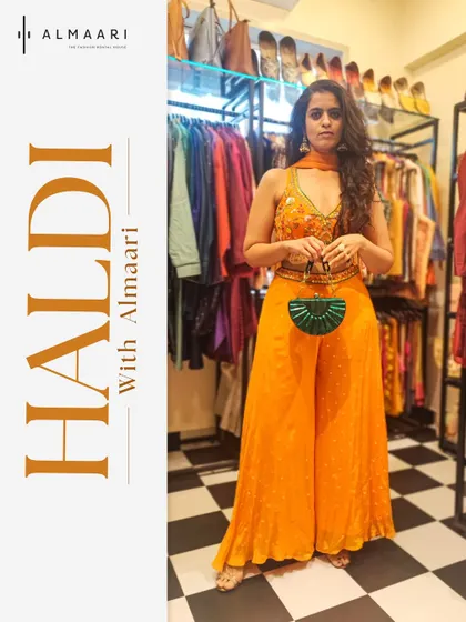 Here I am in our store, showing off a perfect Haldi outfit. This bright orange palazzo set with an embroidered top is comfortable, stylish, and ready for the celebration.
