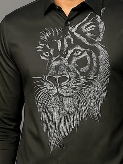 An extreme close-up of the lion's face, where every stitch is visible. This showcases the level of detail that goes into my bespoke embroidered shirts.