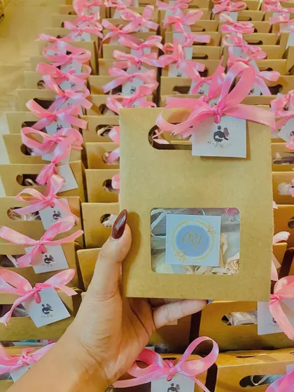 A close-up of the wedding favor bag, showing the custom monogrammed tag. It's a simple yet personal way to thank your guests.