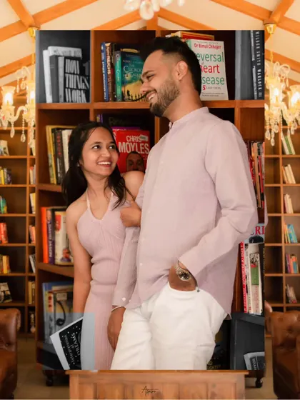 A candid and happy portrait of Nirav and Alpi in the library. Their natural smiles and easy-going posture make this shot feel like a genuine moment captured between two people who love to laugh together.