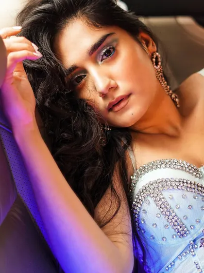 I used colored lighting inside a car to create this glamorous, high-impact shot. It showcases the embellished top and dramatic makeup, perfect for a party wear or beauty campaign.