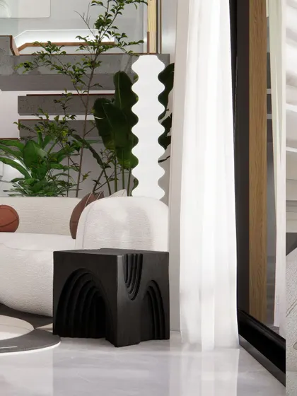 A detail shot highlighting the curated sculptural and decorative objects that bring personality and a sense of mindfulness to the space.