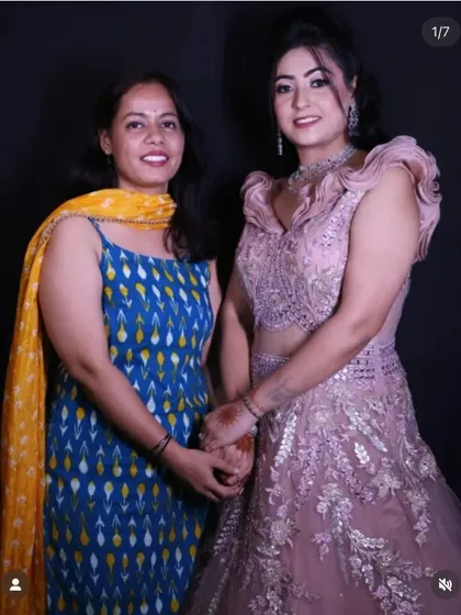 A picture of me with a happy client wearing the dusty pink engagement gown, showcasing the final look and a successful collaboration.