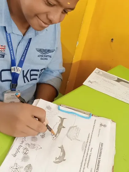 A student at Amara Vidya Niketan proudly works on his drawing. Our competitions are not just about winning; they are about participating, trying your best, and enjoying the process of creating something from your imagination.
