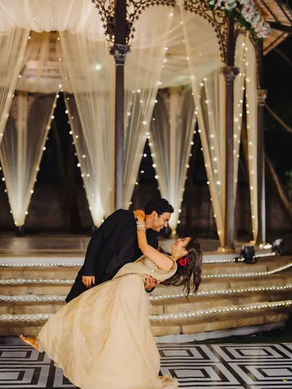 A romantic first dance at the Tamarind Tree, with the couple framed by a beautifully lit gazebo. We focus on creating settings for unforgettable moments.