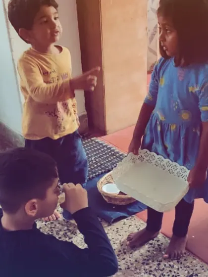 After making herself some lime juice, a young child serves it to her friends who requested a taste. This simple, spontaneous act is a lesson in grace, courtesy, and community living.
