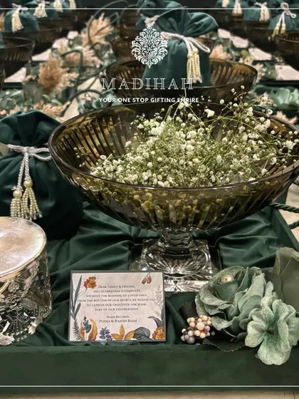 A full view of a Crystal Elfin Hamper, showcasing the large crystal bowl and silver-finished jar on a bed of rich green velvet. The personalized card adds a final, thoughtful touch.