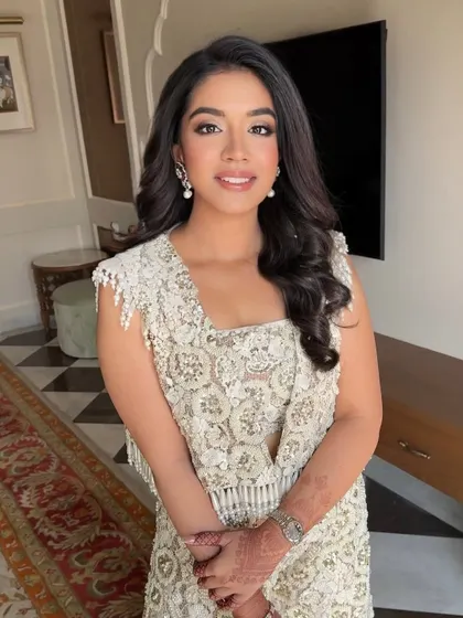 A beautiful portrait showcasing an elegant bridal party look. The makeup is flawless and the soft waves frame her face perfectly.