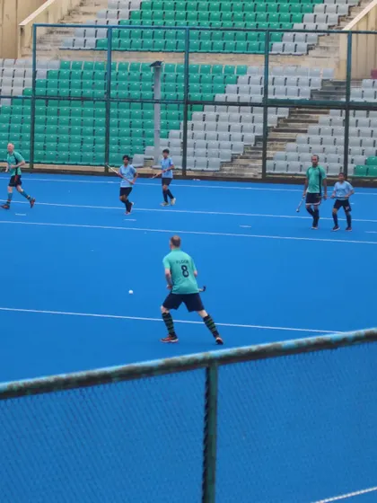 An exciting game against future hockey stars at the National Stadium in Delhi. My players are seen here setting up an attack.