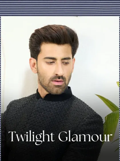 A close-up portrait showcasing the texture and sheen of the black Jodhpuri suit. This piece is designed for twilight glamour and evening sophistication.
