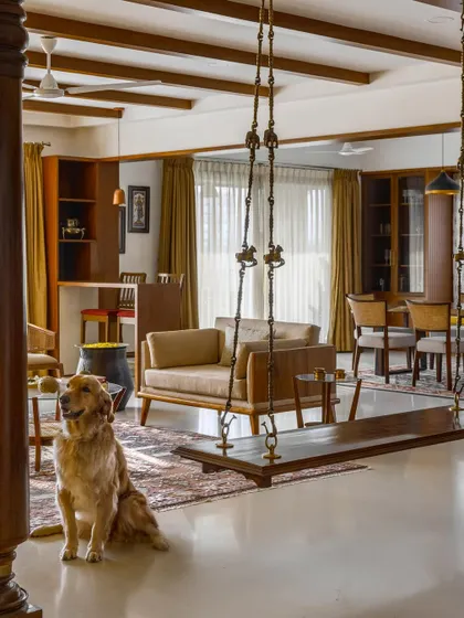 A shot of the 'Vasudhalayah' living room with Max, the family's beloved pet, showing how we design spaces that are welcoming to every member of the family, including the furry ones.