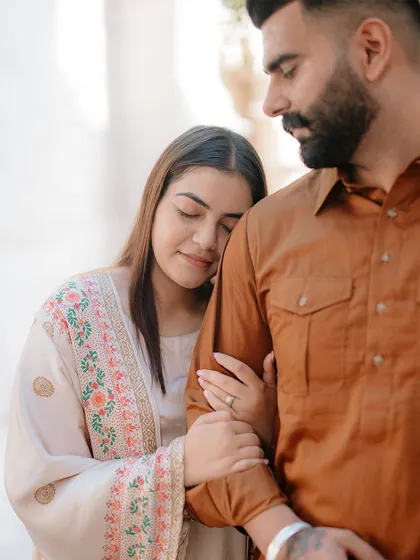A tender and intimate portrait, capturing a quiet moment of connection amidst the historic lanes of Dubai.