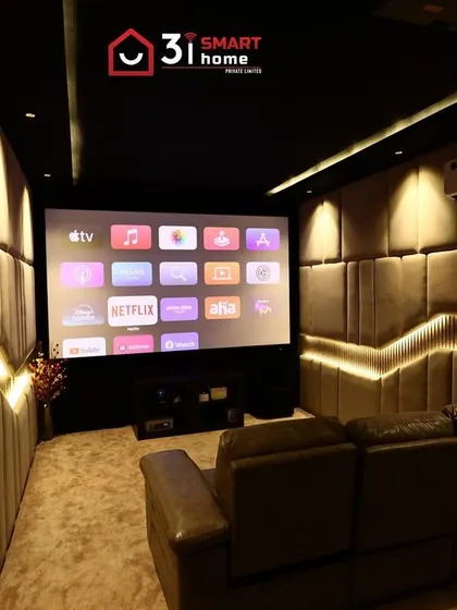 Another view of the Dindigul theater, showing how the warm lighting and soft textures create a space that is both acoustically sound and incredibly inviting.