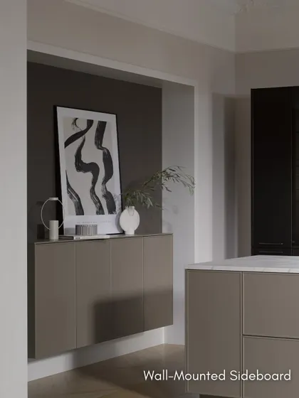 A wall-mounted sideboard in the same finish as the kitchen island extends the design into the living space, creating a cohesive and sophisticated look.