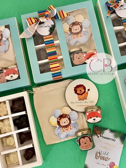 These budget-friendly birthday return favours feature a cute jungle theme. The box includes a customised fridge magnet, handmade mini candles, and our popular animal-shaped handmade chocolates.