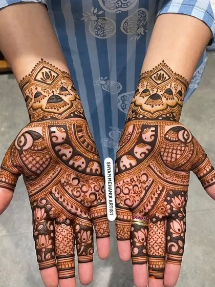 A beautiful, full-palm design featuring elephants and lotus flowers, with a matching pattern on the back of the hands.