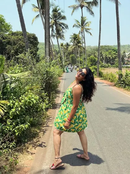 A playful pose in the banana-print sundress. My styling is about finding clothes that match your mood and the moment.