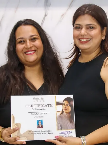 Celebrating another successful artist. Handing over this certificate is more than a formality; it's watching a dream take flight.