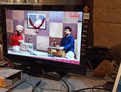 The full frame on the monitor, showing the beautiful chemistry between the tabla and harmonium during my solo performance.