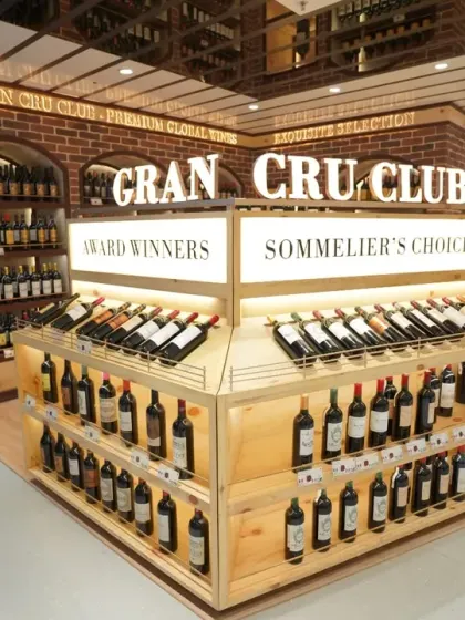 A well-lit shot of the Gran Cru Club's wine selection. We use careful lighting techniques to make products stand out on the shelf, an important aspect of food and beverage photography for retail.