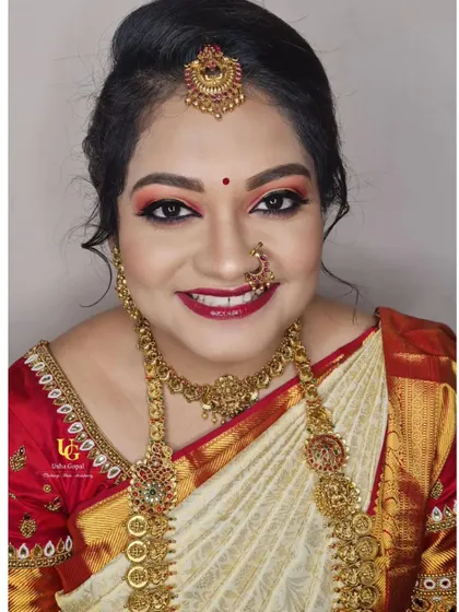 Akshatha's bright smile says it all. It was such a pleasure creating this colourful and glamorous muhurtham look for her.