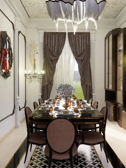 A full view of the formal dining room, where classic design meets opulence. The space is defined by its intricate wall and ceiling details, a statement chandelier, and a striking black-and-white patterned floor.