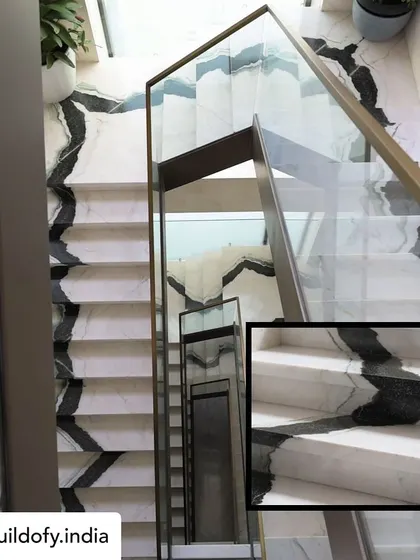 The staircase is often the spine of a home, and I wanted this one to be a dramatic centerpiece. We used bookmatched Panda marble, meticulously ensuring the natural veins flow seamlessly from the ground floor to the top. It’s a bold architectural statement that showcases the beauty of natural stone.