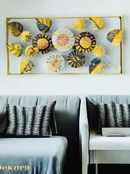 This rectangular framed piece features an abstract arrangement of flowers and leaves in a striking yellow, black, and white color palette. It's a modern interpretation of a classic floral theme.