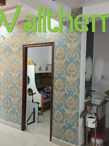 A classic blue and gold damask wallpaper installed in a hallway, adding a touch of elegance to a transitional space.