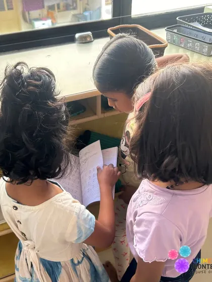 Older children proudly show their work to younger peers, reinforcing their own learning and inspiring the little ones.