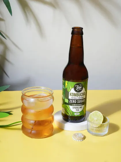 A bright and sunny product shot for Toyo Kombucha. The yellow background and fresh lime create a healthy and refreshing vibe for this zero sugar sparkling tea.
